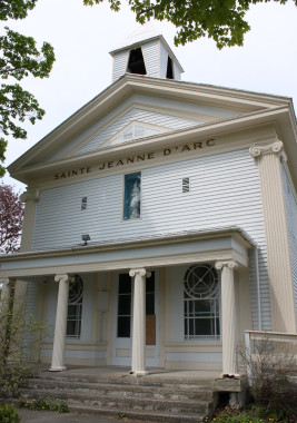 Upon leaving the Cornell Mill, cross the street to the former Sainte-Jeanne-d'Arc Catholic Church (7 River Street). This splendid neo-classical edifice was actually built as a bank in 1861. It served first as the Baker Bank, and then as a branch of the Eastern Townships Bank, the Sovereign Bank, and finally the Bank of Commerce. In 1952, the building was converted to a Catholic Church. The church closed some years ago, and the building has since been sold.