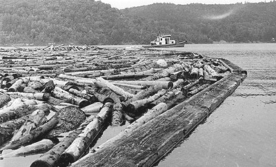 Tug boat towing log boom at Burnett, Chelsea, c.1975