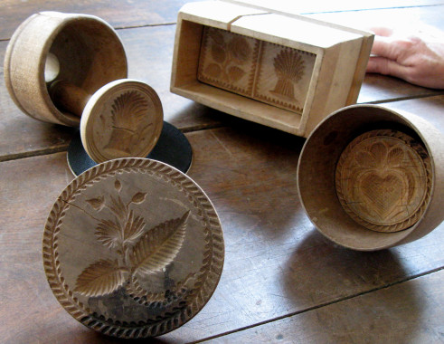 Butter moulds.
These hand-carved wooden butter moulds are part of the Pickford collection, donated in 1980 by Osborne Pickford of Bury. After churning, butter was washed three to four times in clear, cold water. Salt was added according to taste. For extra flavour, one tablespoon of salt and one tablespoon of sugar were added for every eight pounds of butter.
(Compton County Museum Collection / Photo - Jackie Hyman)