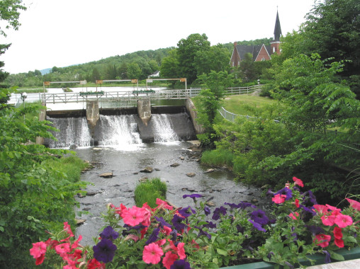 Picturesque Knowlton is known for its architecture as well as its charm. This view shows the dam on the mill pond from the bridge. The United Church is visible in the distance to the right. (Photo - Matthew Farfan)