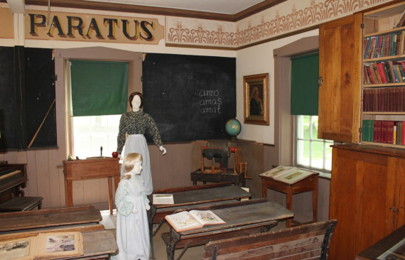 Inside the Academy Building, the ground floor has retained some of its original schoolroom appearance. The blackboards, wall stencilling, and desks are all still in place. (Photo - Matthew Farfan)