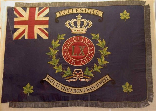 The Colours of the 60th Missisquoi Battalion Volunteer Militia of Canada, Eccles Hill, 1870.
Under the command of Lt-Col. Brown Chamberlain, the 60th Missisquoi Battalion helped to reinforce the Home Guard Red Sashes at Eccles Hill. The colours were in the possession of Colonel Arthur Gilmour who marched with the 60th Missisquoi Battalion at Eccles Hill in 1870. The colours were made and presented to the 60th Battalion by women of the community in recognition for their service. (Missisquoi Historical Socie