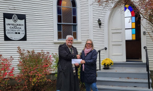 QAHN makes financial contribution to Georgeville HS's church purchase
