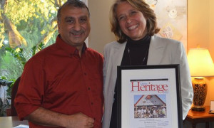Lachine Mayor Maja Vodanovich (right) received a framed copy of Quebec Heritage News from Ro Ghandhi (September 2019)