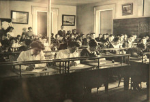 <strong>HIGHER EDUCATION.</strong>
Photograph, c. early 1900s, possibly depicting an examination in progress. Note the teachers standing at the rear. (Compton County Museum Collection / Farnsworth Family Fonds)
