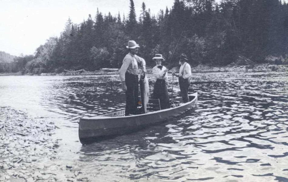 Gertrude and her salmon, early 20th century. Women have enjoyed coming to the magnificent Cascapedia for a century and a half. One woman who was especially charmed by the river was Princess Louise, who stayed in Woodman House on her first trip to the river in 1879. (Photo - Cascapedia River Museum Collection)