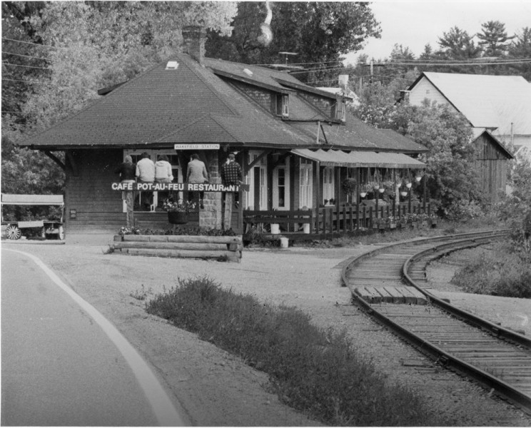 Railway Station. This is the second Wakefield railway station to be built in the village. It became a popular restaurant called "Pot-au-Feu" after the passenger and freight trains ceased to run on the Gatineau line around 1960. The building still has the look and feel of a railway station, located as it is beside the tracks of the tourist steam train in the centre of the village. A deck has been added at the back of the building overlooking the river, adding to its allure as a place to have a meal while