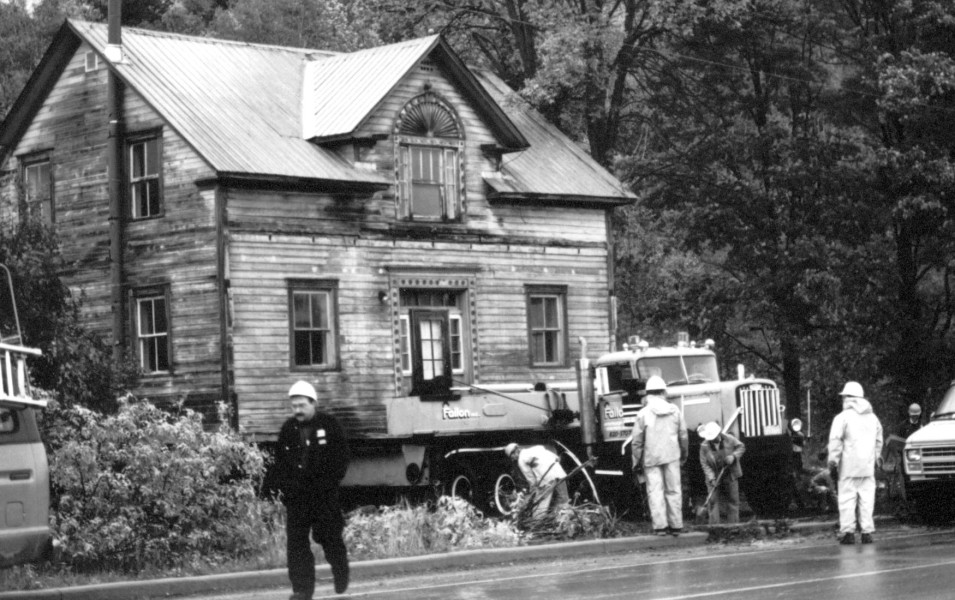 A Moving Moment in History. Saving our historical properties takes strong community interest and efforts. After historians raised awareness and campaigned to save the historic Fairbairn house from demolition in 1991, a local businessman assumed the costs for moving the house to his own property. In this picture, the old house is almost ready to vacate the farm where it had been a landmark beside the main Gatineau road for 130 years. 
(Photo - GVHS #009/01260)
