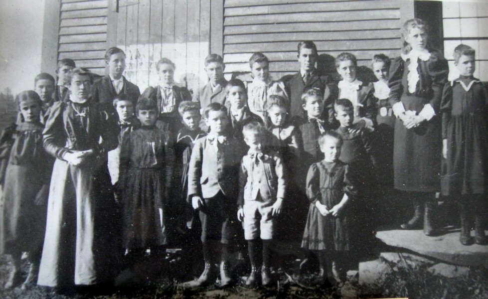 <strong>FLANDERS SCHOOL.</strong>
The Flanders School near Sawyerville was one of many one-room elementary schools in the area. The teacher seen in this undated photograph was Anna Lebdell. (Compton County Museum Collection)
