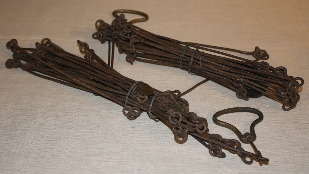 Surveyor's Chains, 18th century.
The unsung heroes of settlement were surveyors who faced virgin forest, thick clouds of mosquitoes, and with their instruments and chains, ran survey lines over hills and through swamps and tangled undergrowth. It was only after their work was completed that the actual carving of a road could commence. (Missisquoi Historical Society Collections)