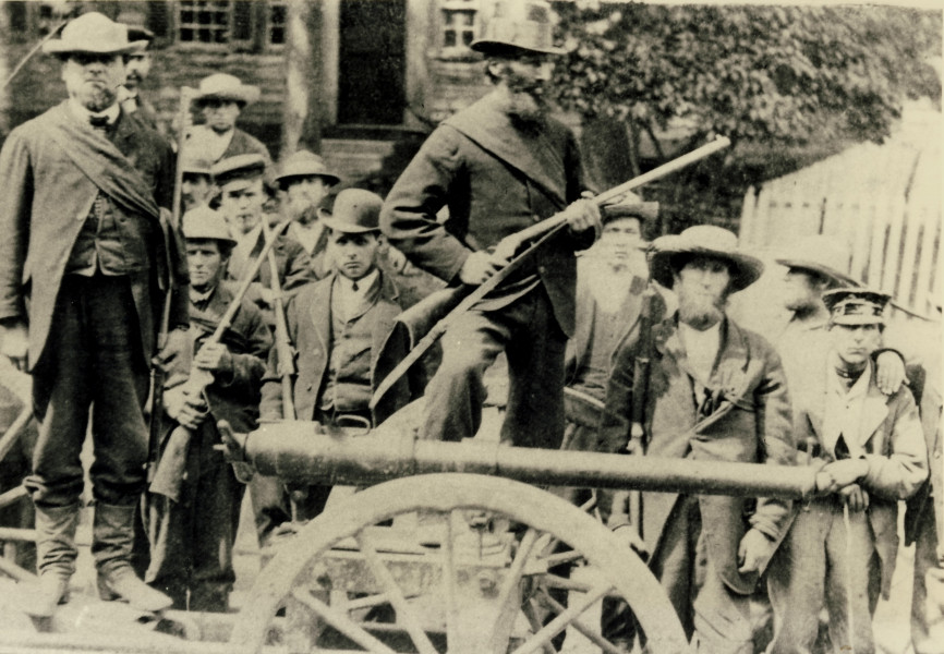 Photograph of the captured Fenian canon and men of the Missisquoi Home Guard (the Red Sashes) following the raid on Eccles Hill, 1870. (Missisquoi Historical Society Collections)