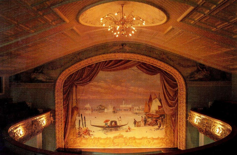 The curtain, scenery and props in the opera house are complete and all-original. They are the only known surviving work of the Boston stage artist Erwin LaMoss. The magnificent main drop curtain, seen here, features a view of Venice. (Photo - Whipple Studio)