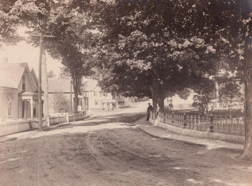 The village square, Derby Line, Vermont, c.1900. The area directly beyond the gazebo would become the site of the Haskell Free Library. The property on the right hand side of the street belonged to the Haskells. (Photo - J. J. Parker / Haskell Archives)