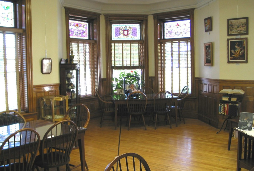 The elegant reading room has changed very little over the past century. Note the black line on the floor, which indicates the path of the international border as it traverses the building. (Photo - Matthew Farfan)